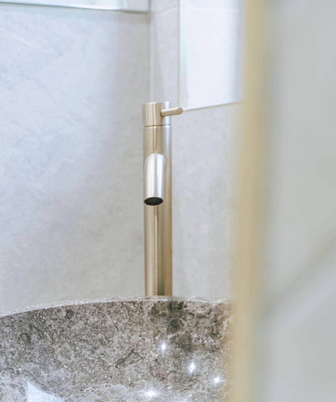 Brushed brass mono basin tap installation in South West London