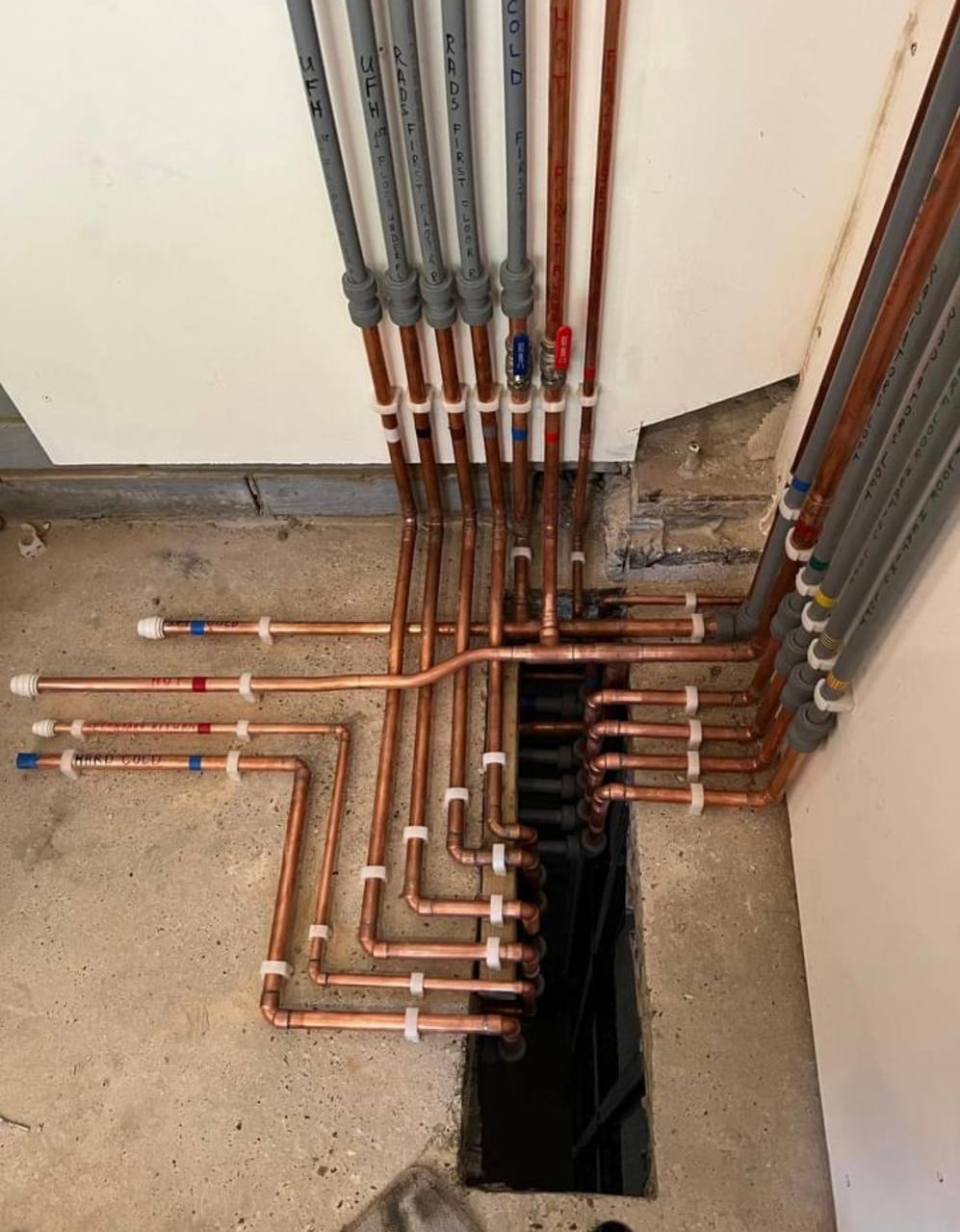 Central heating pipework repairs and manifold in a South West London property