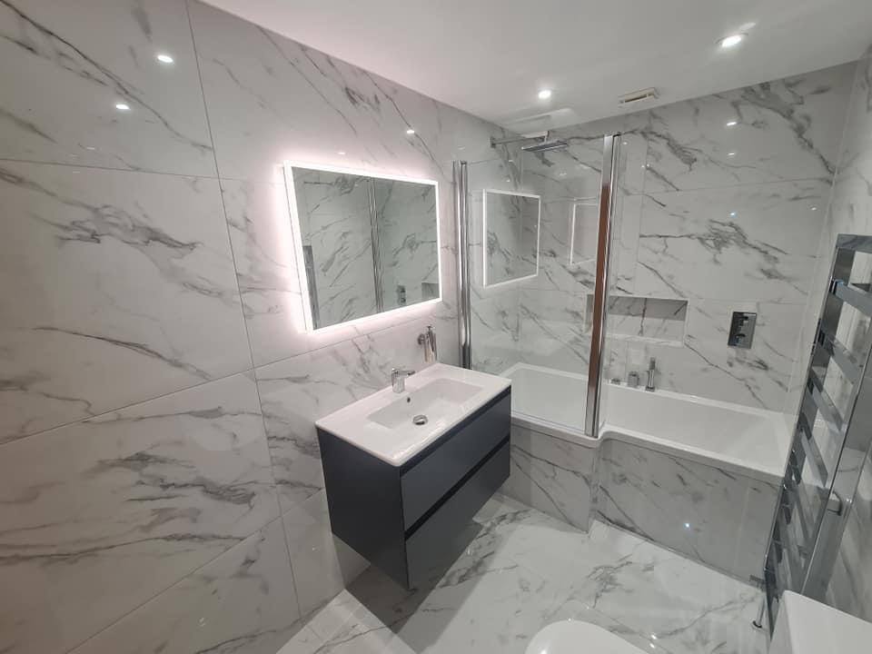 Full bathroom renovation with marble tiling in South West London