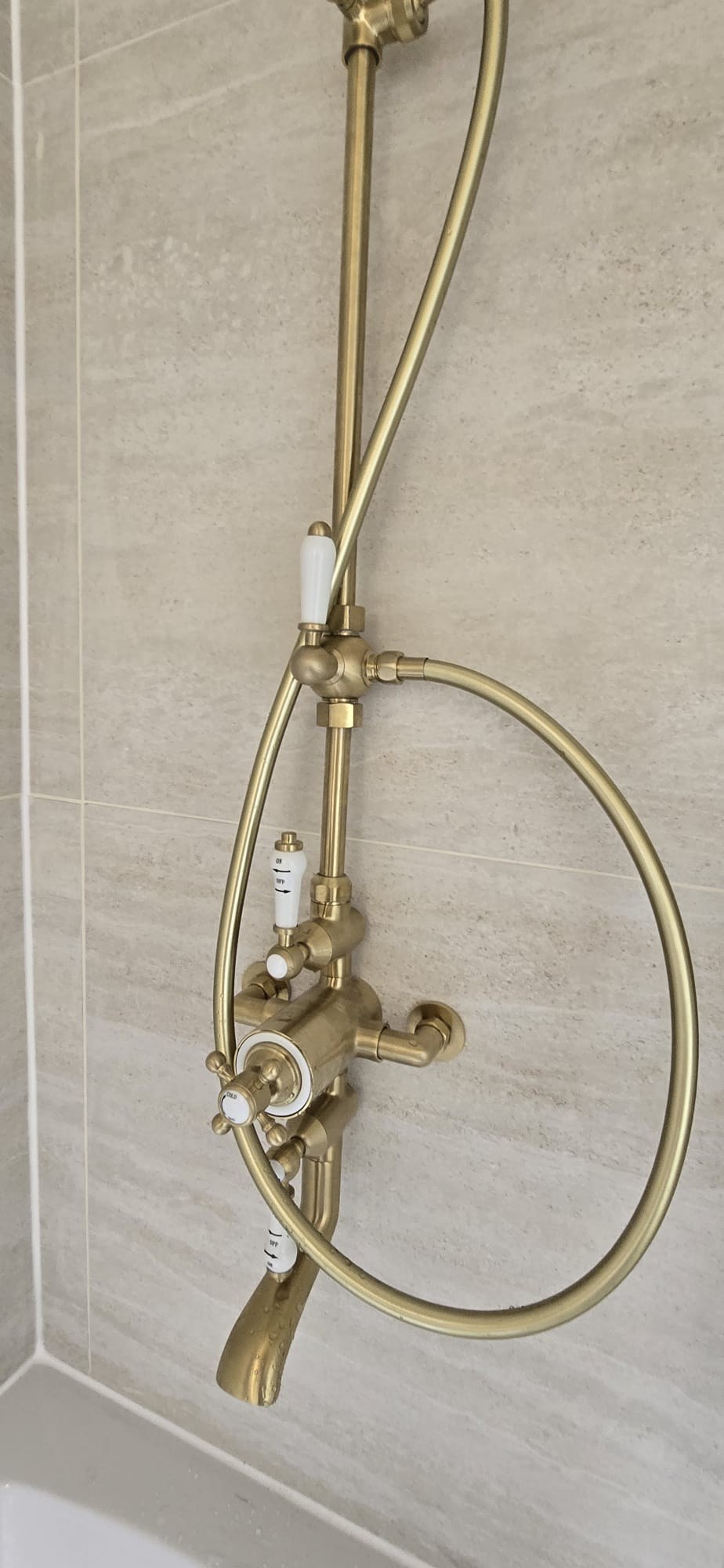Bathroom renovation with brass shower fittings by Maxfix in Kensington
