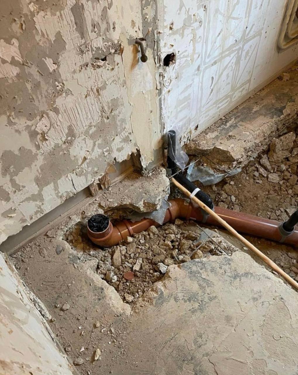Leak detection and pipe repair works exposing concealed pipework in South West London