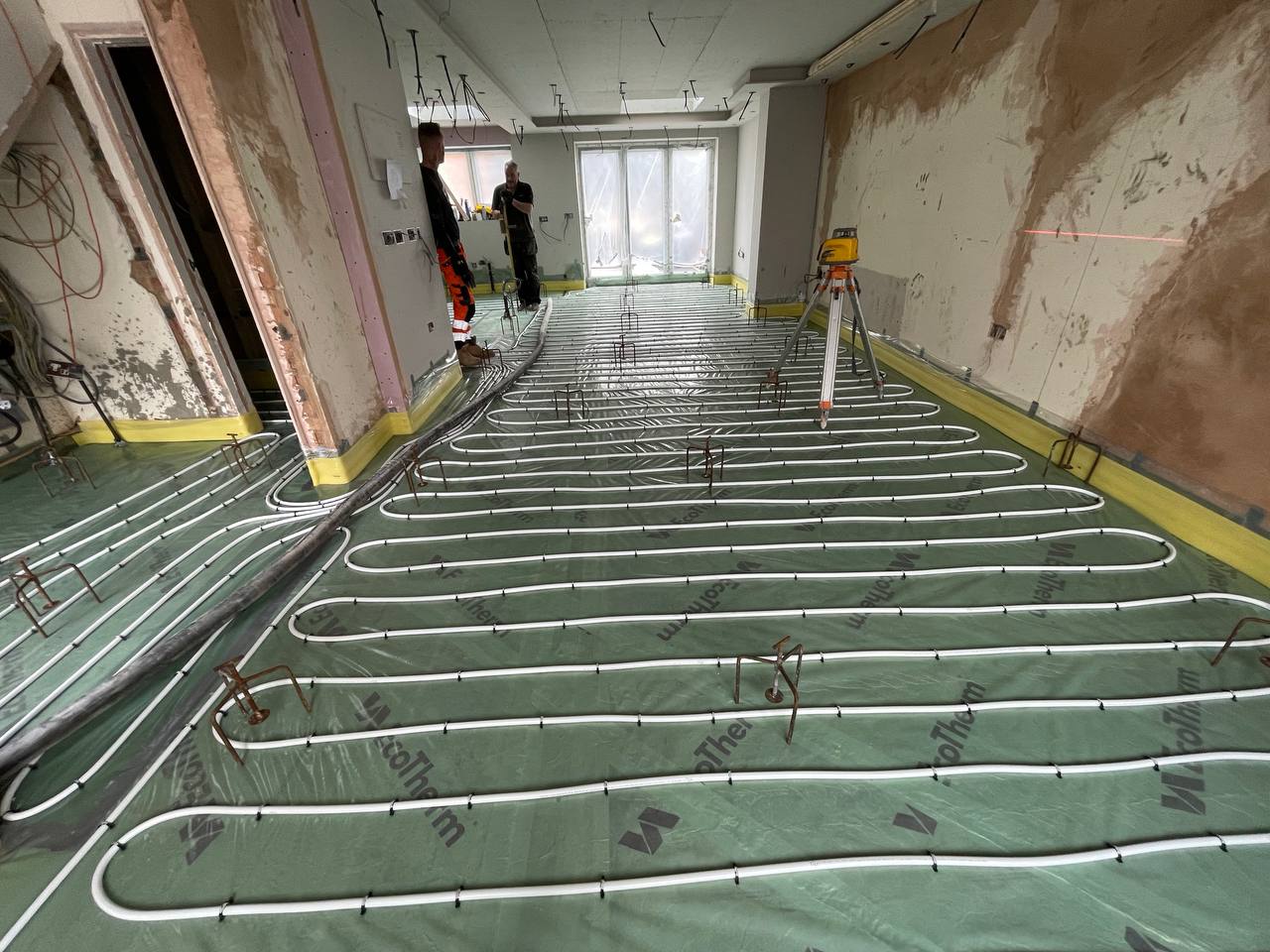 Wet underfloor heating pipework laid before screeding in a South West London extension