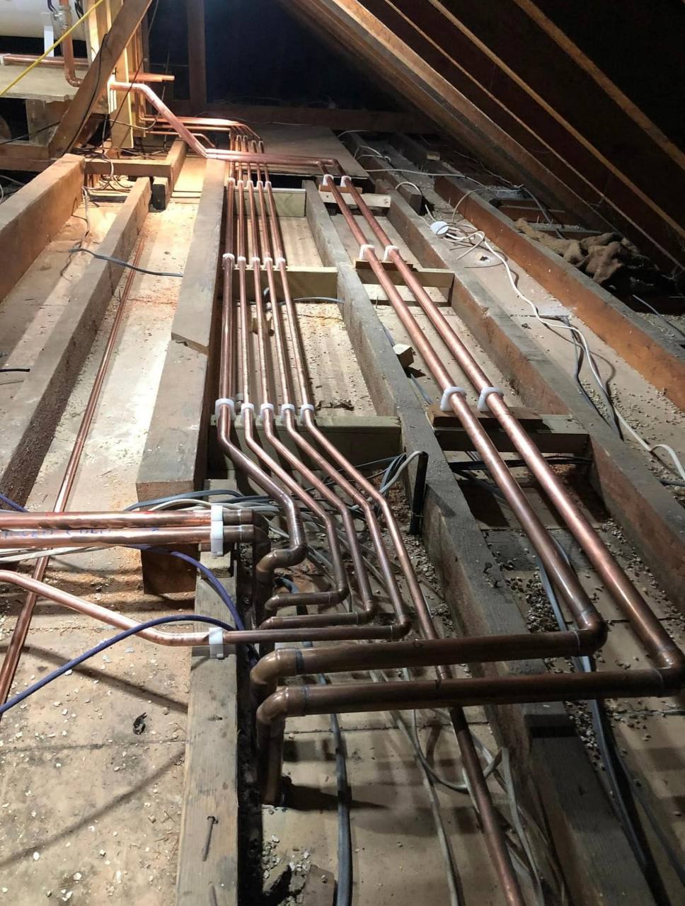 Copper radiator pipework installation in a South West London loft