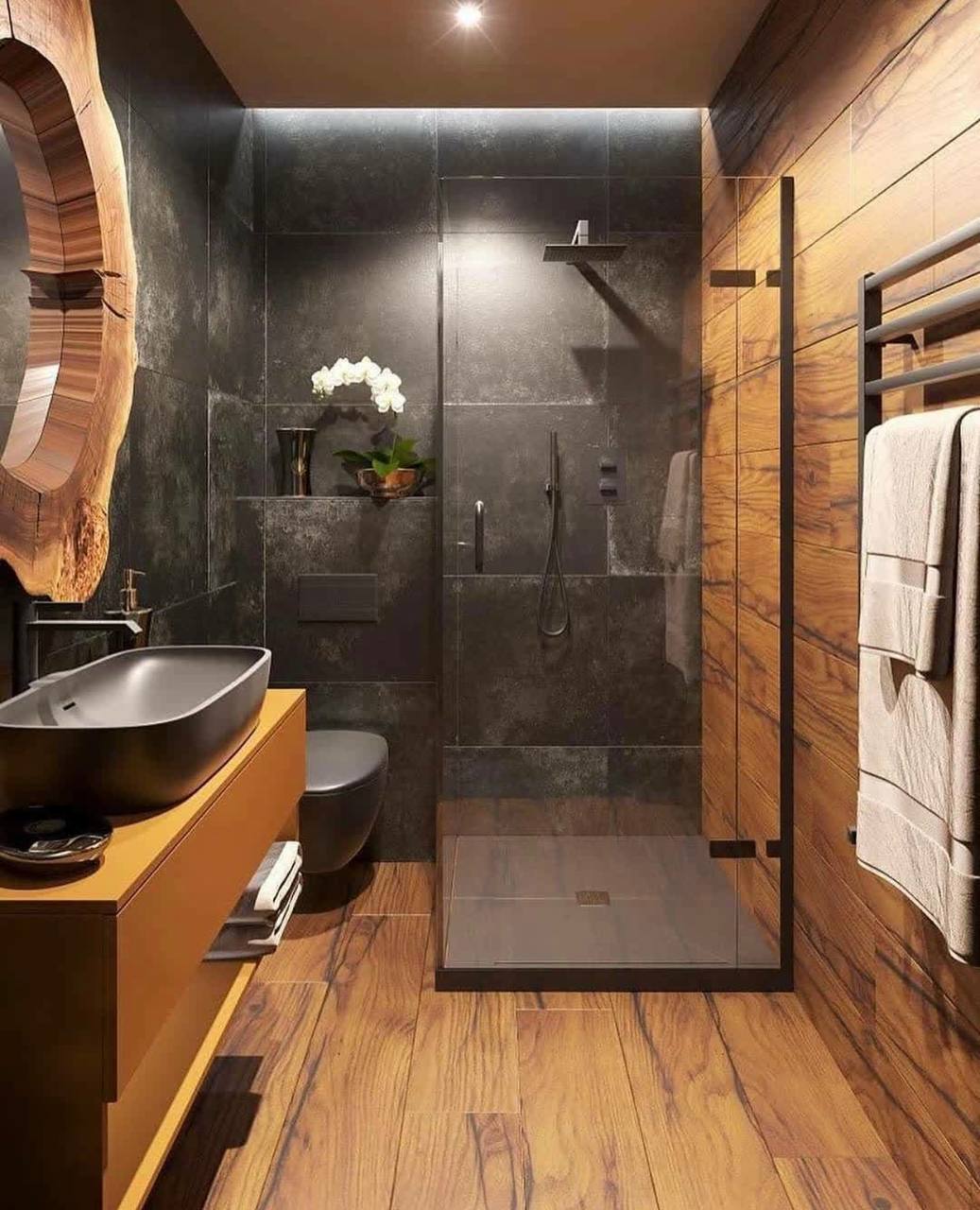 Luxury bathroom with marble walls and freestanding bath in South West London